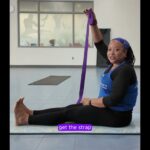 Sista use the strap for a deeper lower back stretch.
